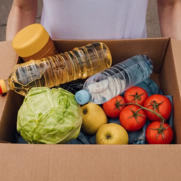 close-up-woman-with-cardboard-box-with-different-f-2024-10-18-08-33-53-utc-1.jpg